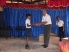 mr-gotabhaya-donating-shoes-to-masmulla-child